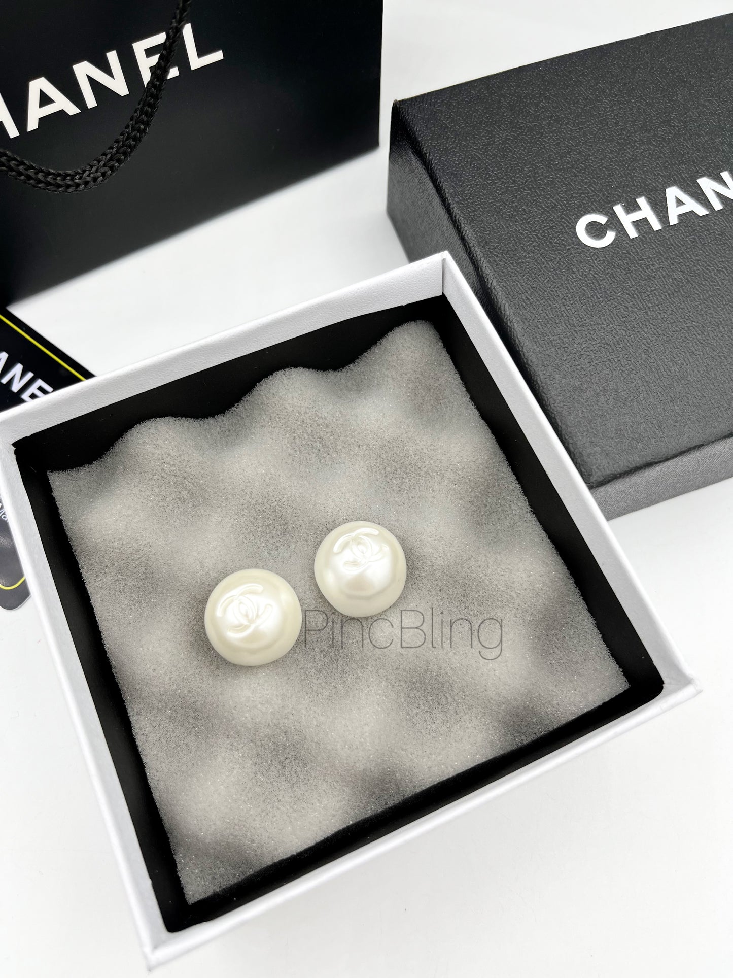 Pearl punched branded earrings chnl