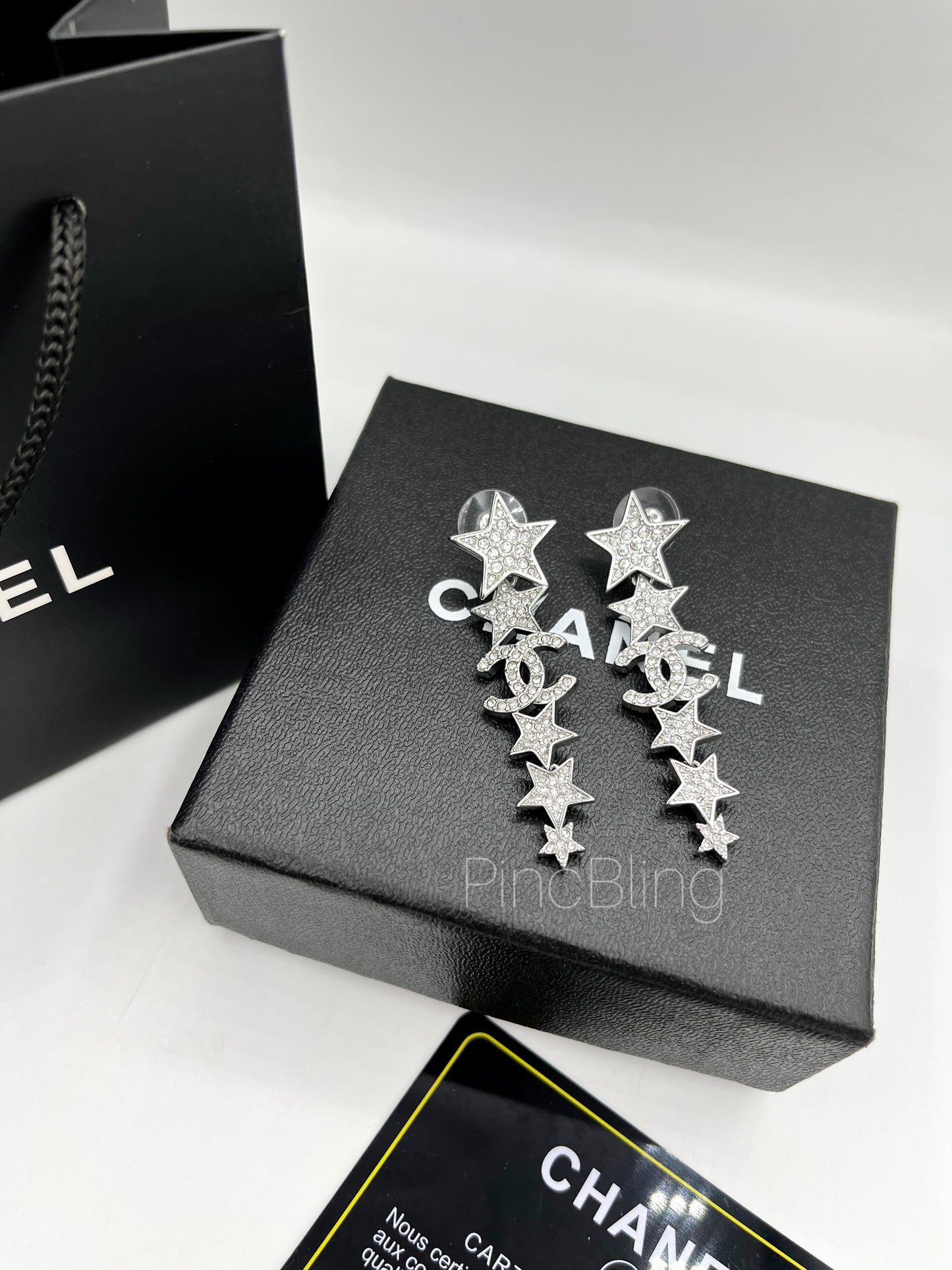Sparkling branded earrings chnl