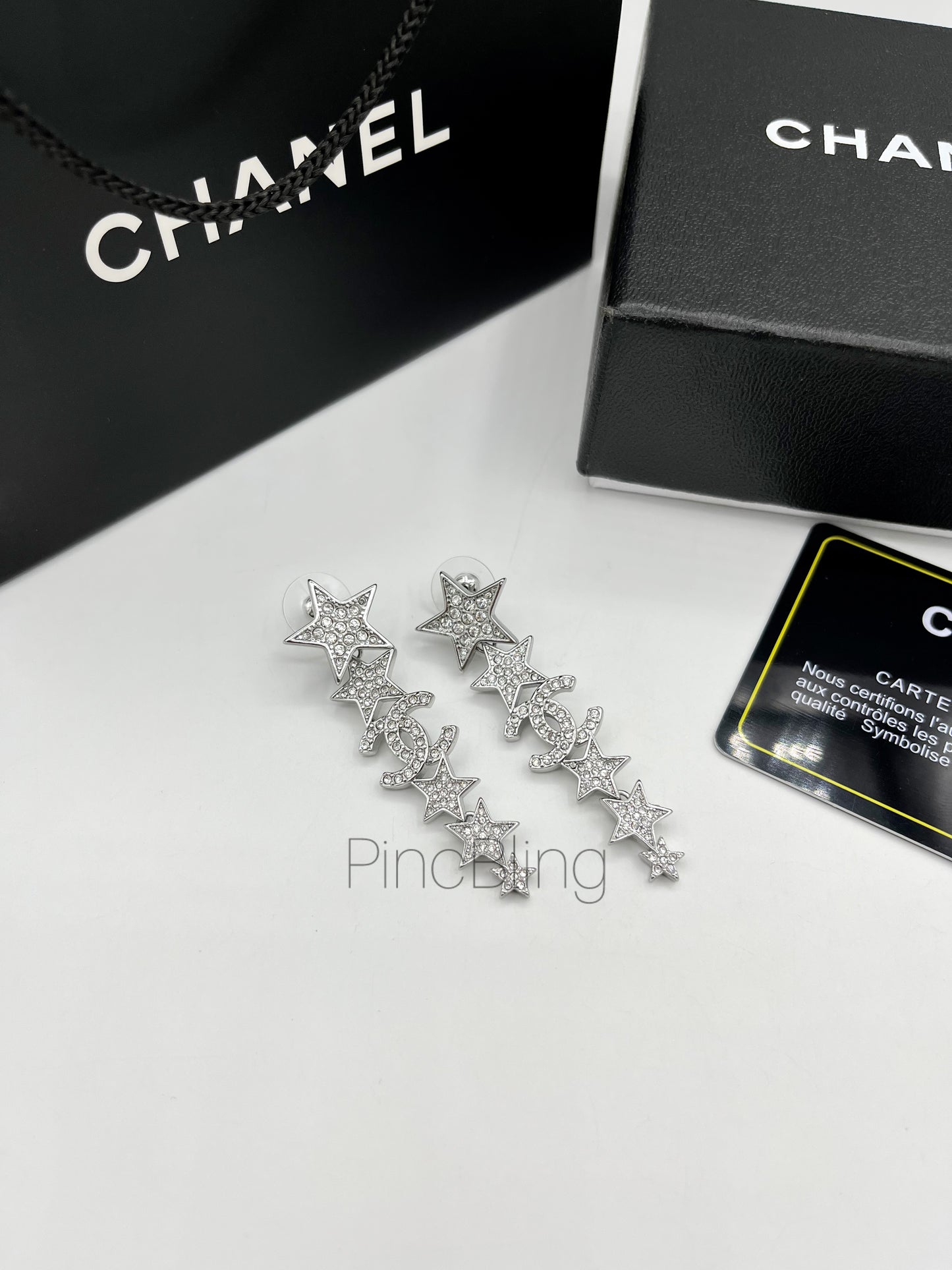 Sparkling branded earrings chnl