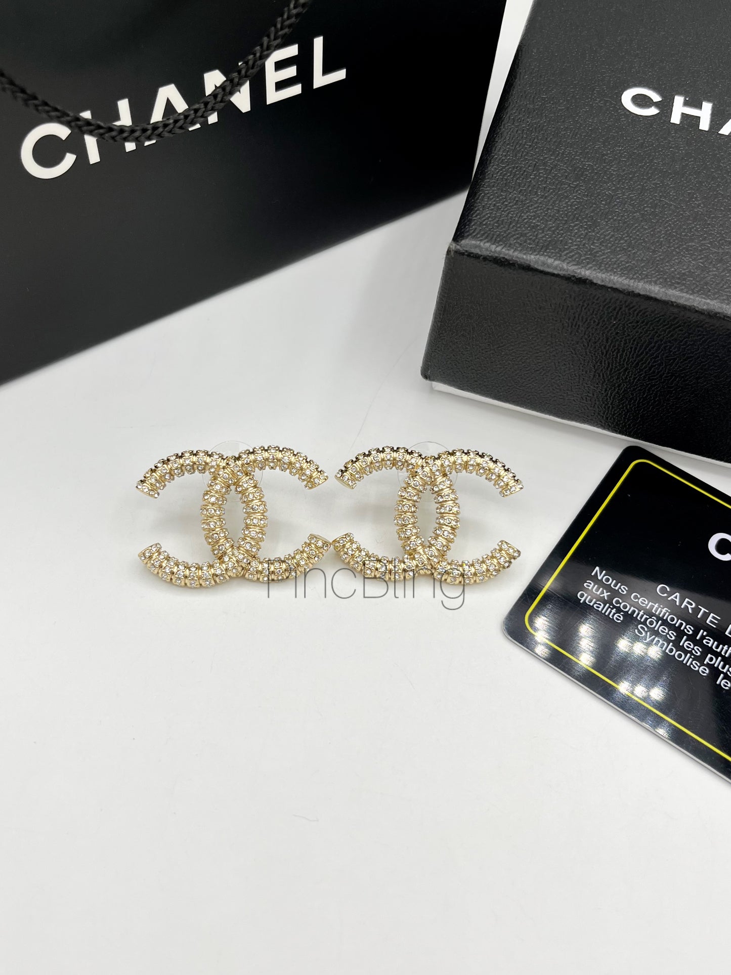 Sparke branded earrings chnl