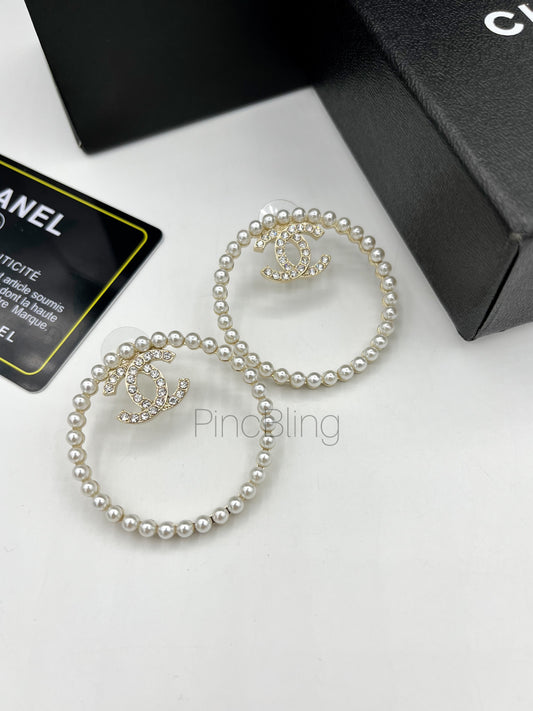 Round branded earrings chnl